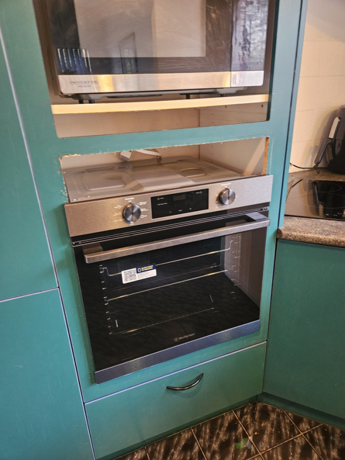 Oven Change over to New, kitchen installers to lift and build shelf.