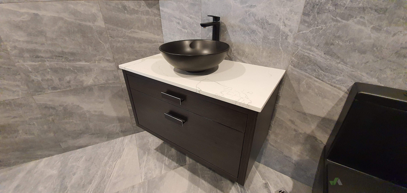 Modern bathroom vanity and basin installation – clean, precise plumbing with a premium finish.