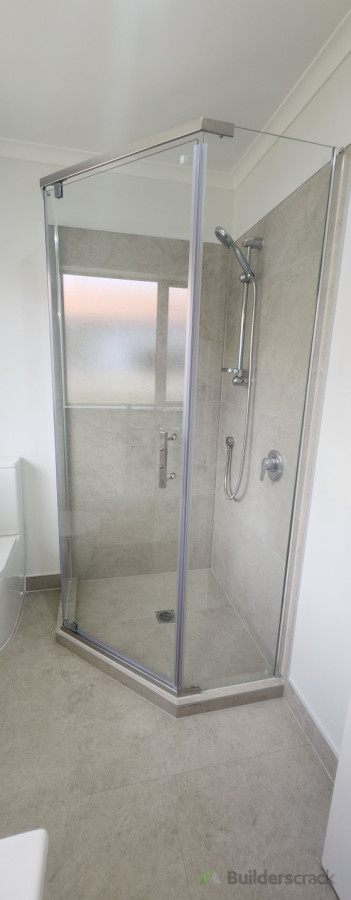 Corner shower installation – professionally plumbed, level, and finished to NZ standards.