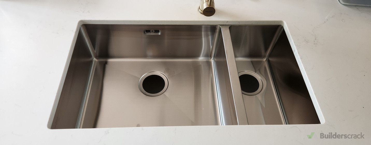 Kitchen sink installation – accurate cut-out, secure fittings, and clean finish.