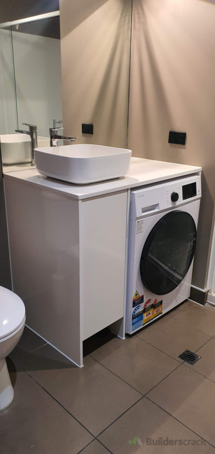 Compact bathroom and laundry plumbing installation – smart layout with clean, functional finish.