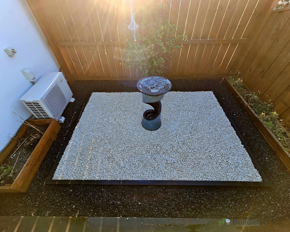Small water feature with combination of Black &  white stone