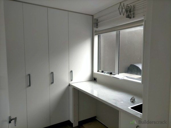 Downstairs laundry toilet and hallway