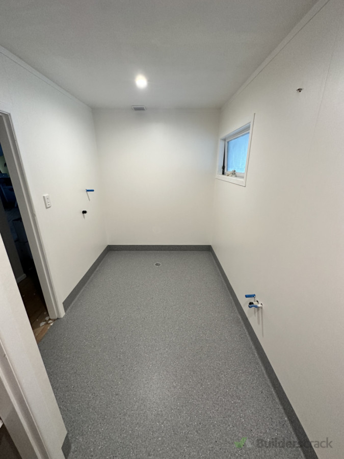 Wet floor bathroom. Vinyl floors and walls