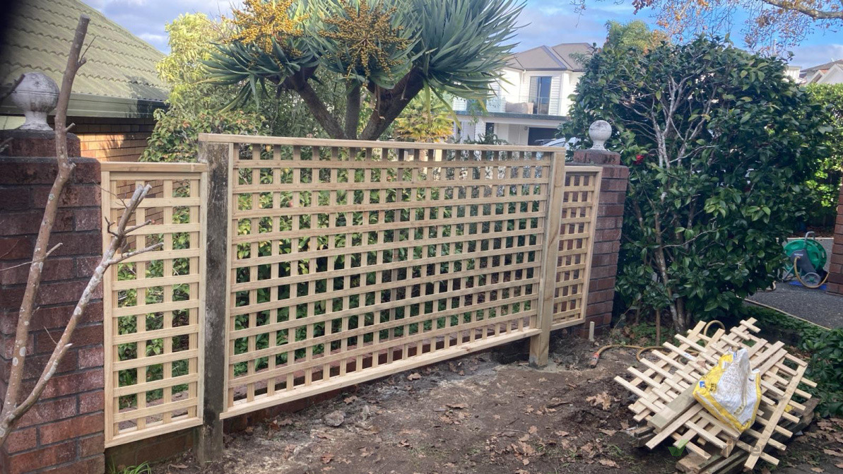 Removed old trellis and rotted out post. Install new trellis and one post still in good condition owner to water blast and stain