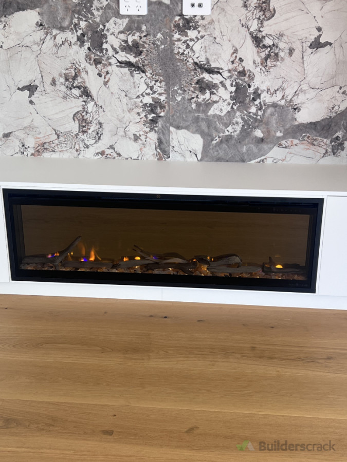 Electrical fit-off and connection for modern electric fireplace to provide efficient heating and aesthetic enhancement.