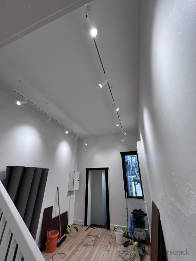 Track lighting system installation as part of renovation works – providing flexible illumination suitable for modern residential interiors.