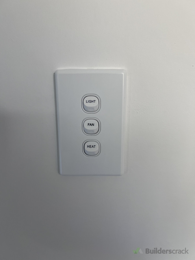 Installation of dedicated 3-in-1 bathroom control switch for lighting, extraction fan, and heating unit – ensuring safe, compliant, and user-friendly operation in wet areas.