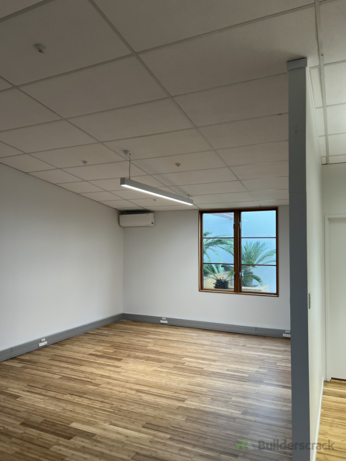 Installation of suspended LED linear lighting system to provide uniform illumination in a commercial office environment.