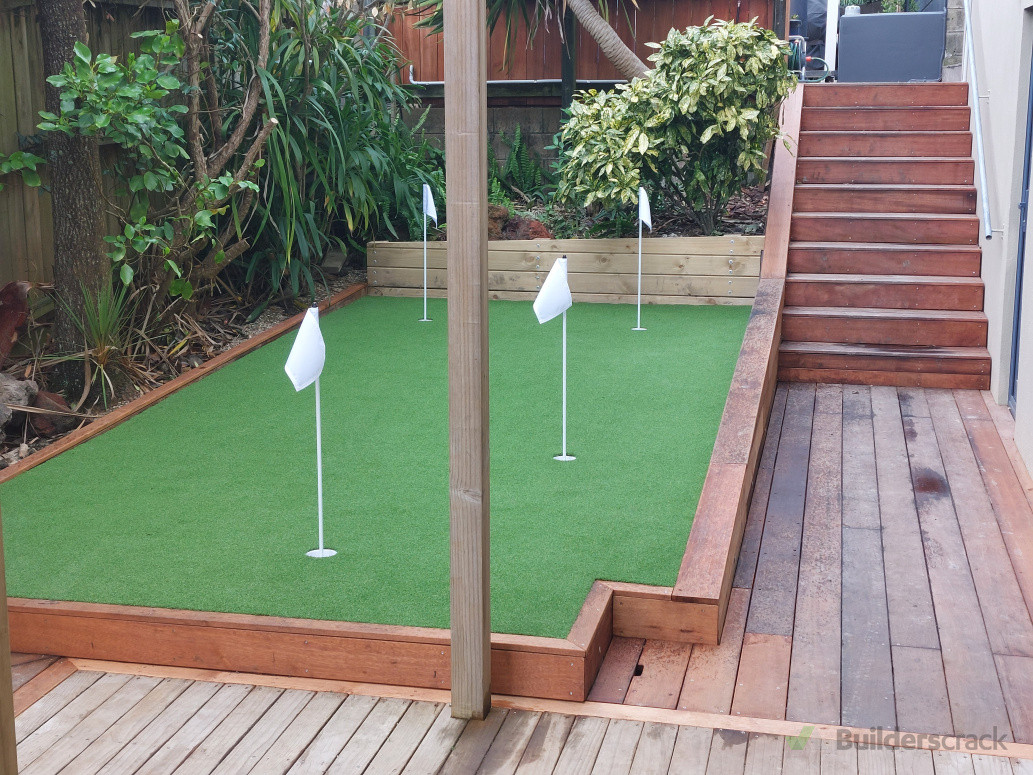 Great use of a small space. New putting green and accompanying decking and stairs