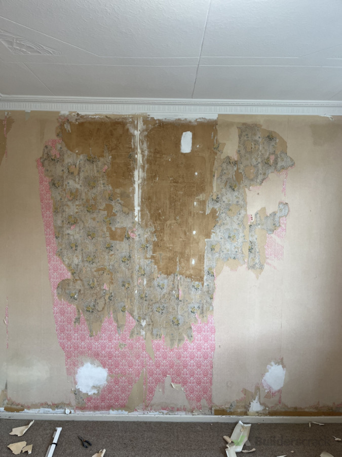I’d already taken off the first layer of wallpaper. This wall had three
