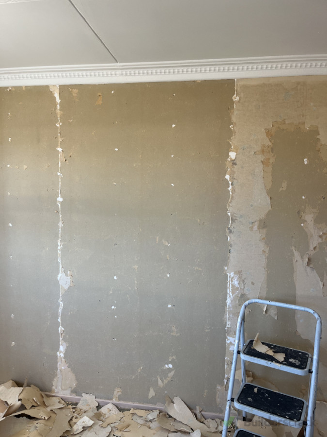 Some areas came off easily. Other areas like to the right of this picture, I couldn’t remove and had to skim it with plaster