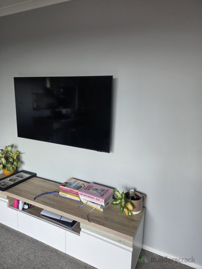 Wall mounted tv and cabling run through wall for ps5