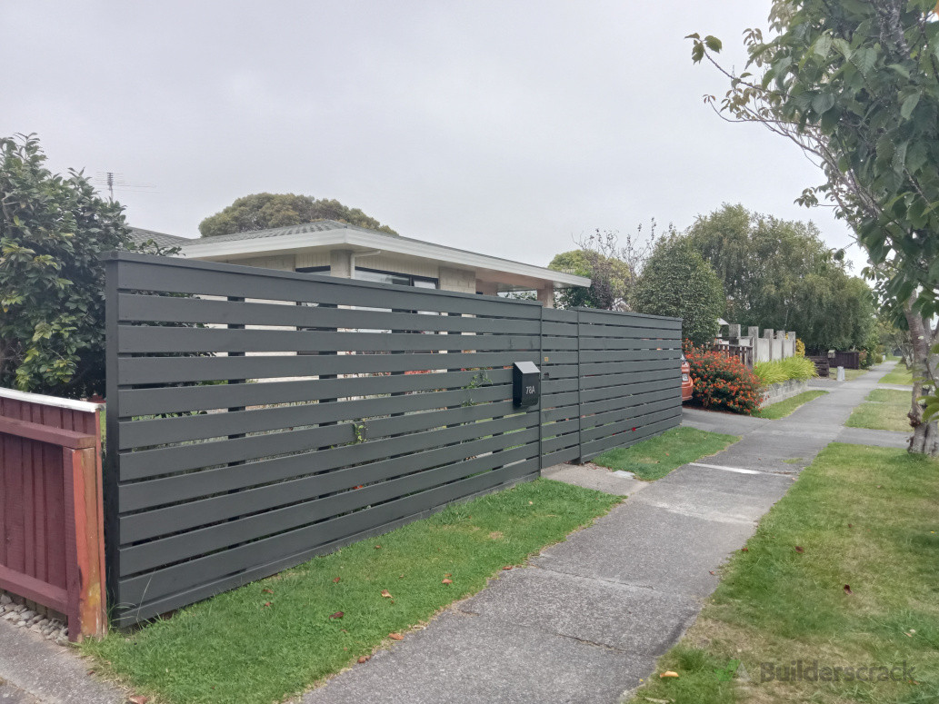 Horizontal paling boundary fence, painted black with clean lines, strong finish, built to last.