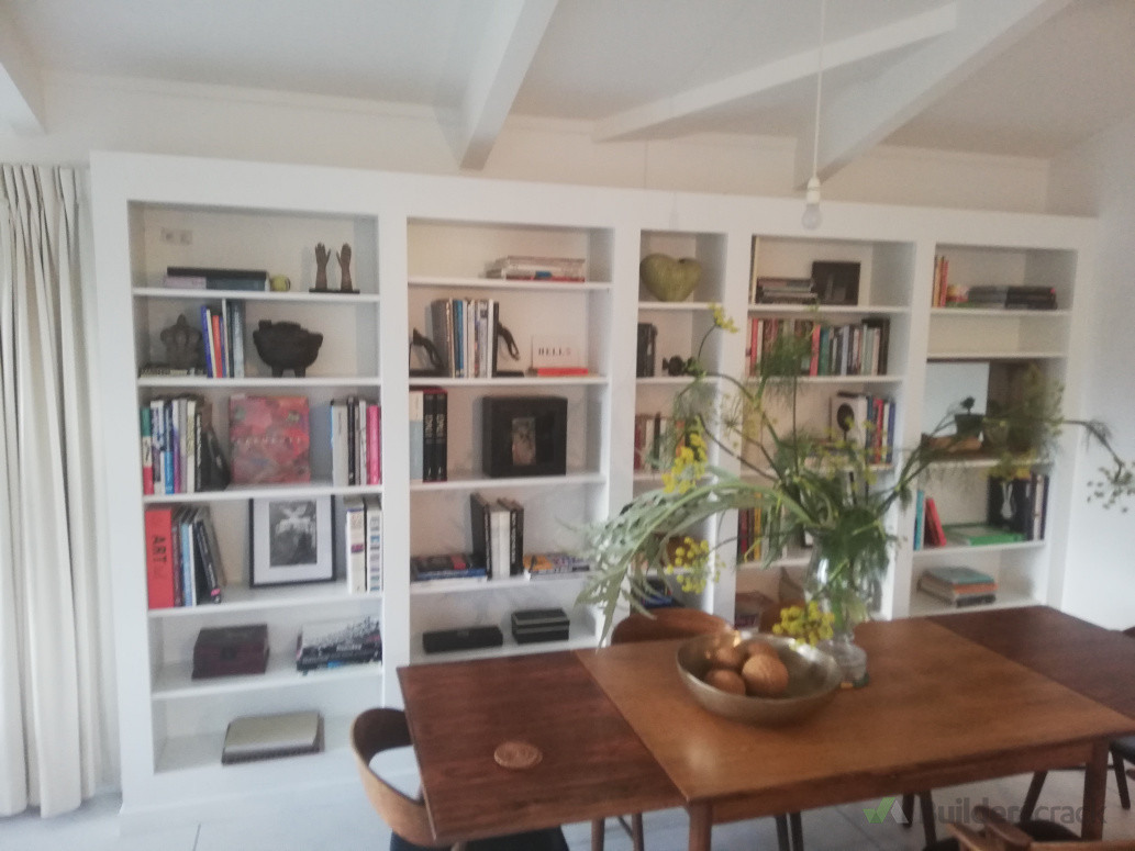 Custom built bookcase designed to maximise storage while complementing the space with clean timeless lines.