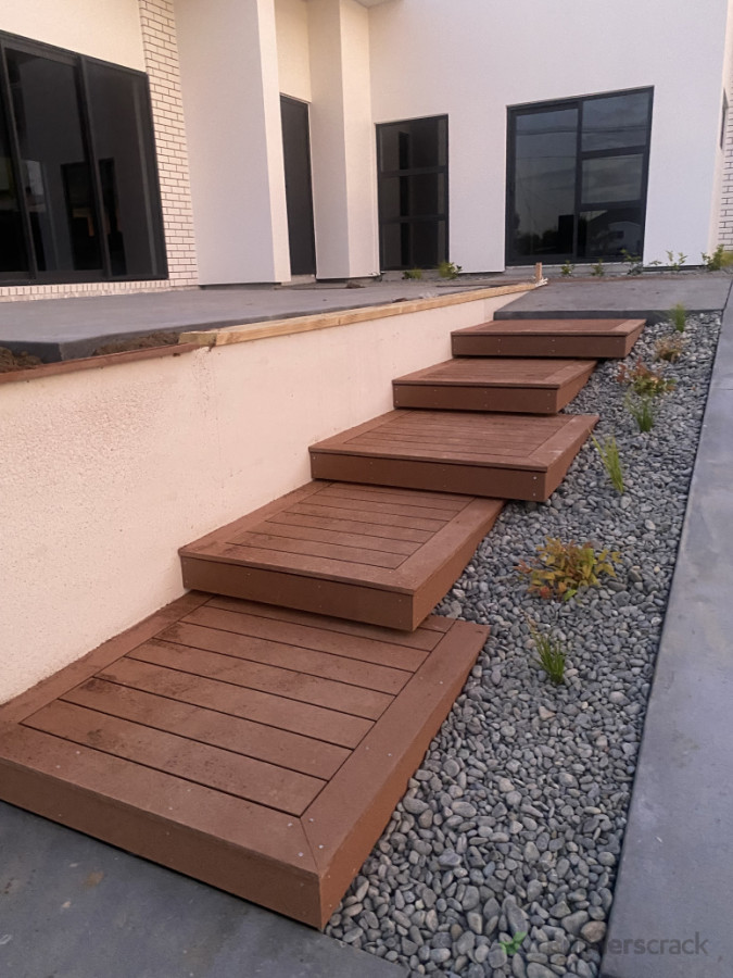 Composite deck with retaining wall.