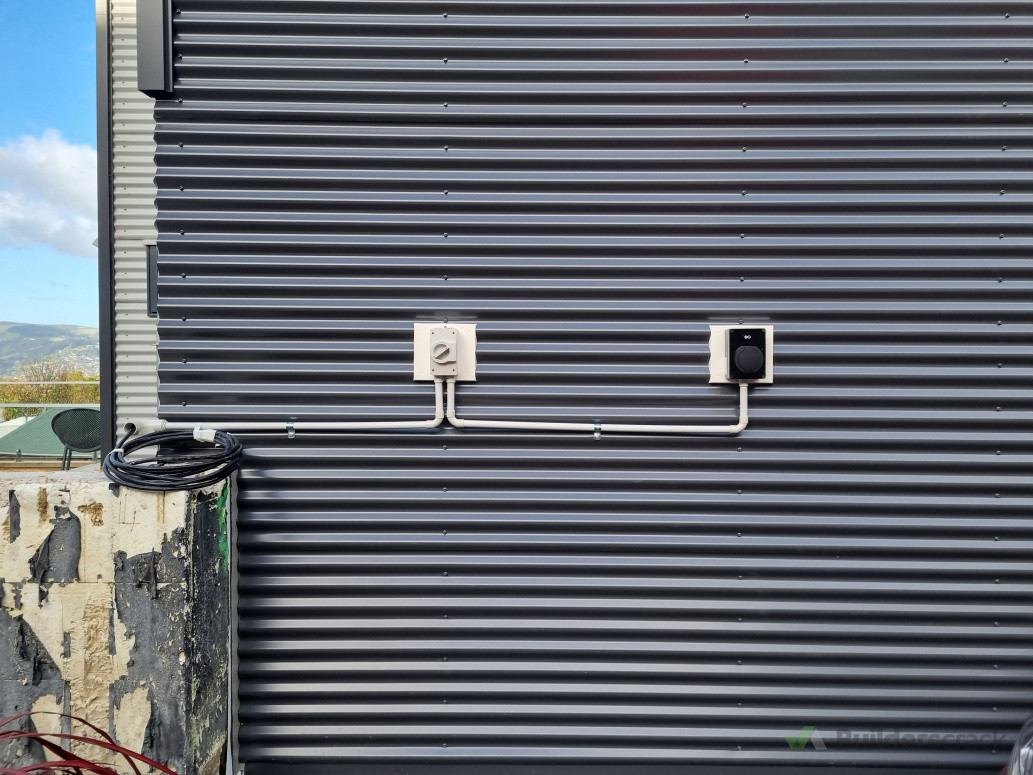 EV Charger installed on corrugate cladding