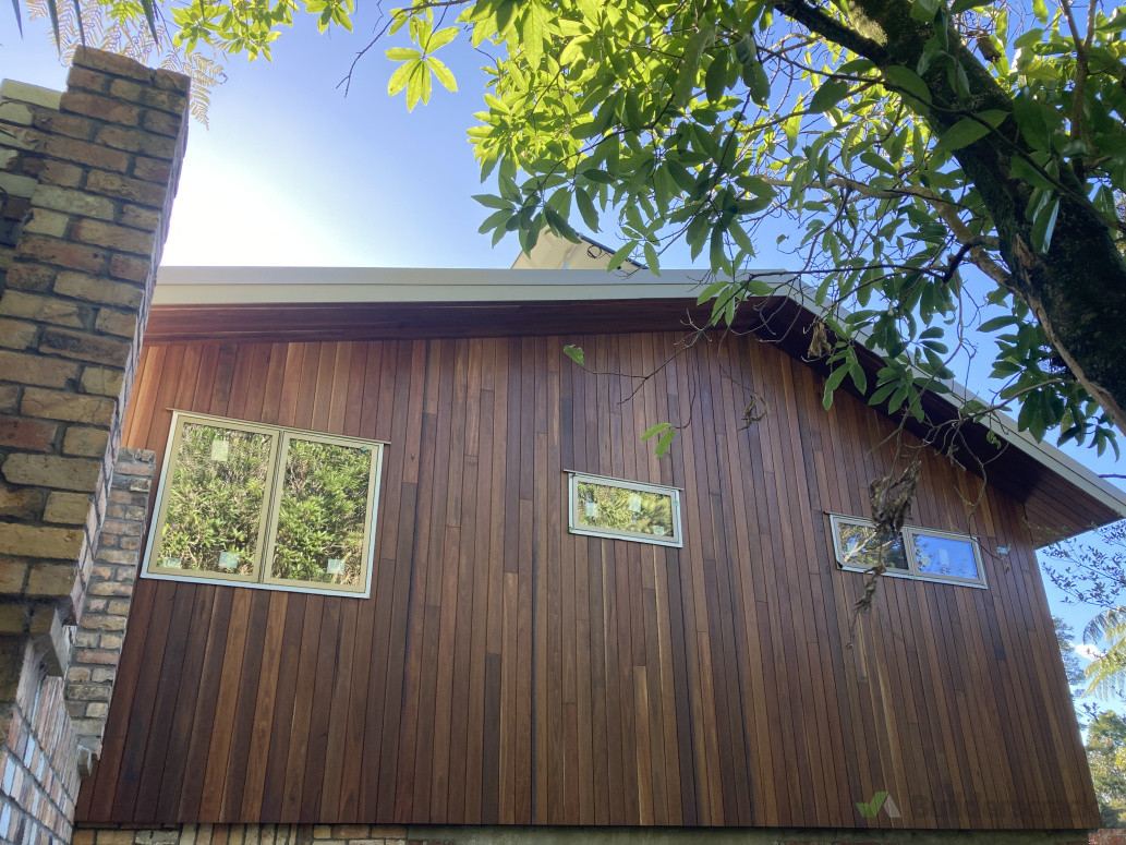 Window install and timber cladding spotted gum installed carefully to create pattern zoom in and spot the system. Good view of fascia board install