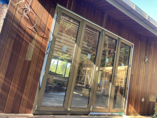 Installed bifold door, cladding and soffit