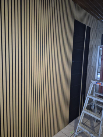 Installation of decorative timber slat feature wall.