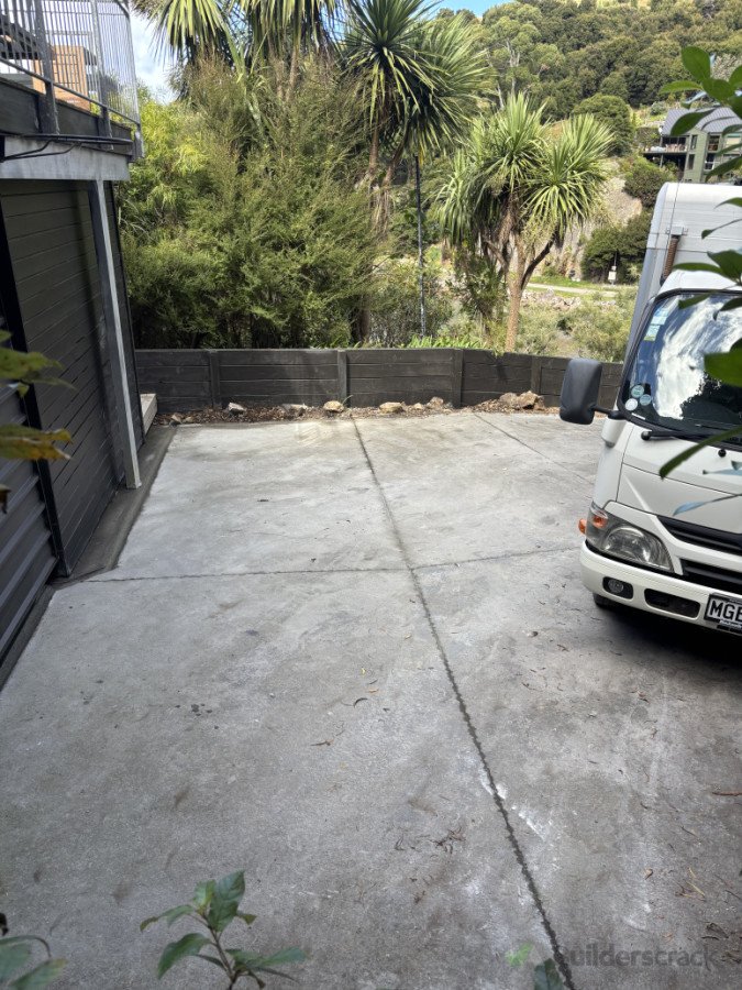 A simple cost effective solution to stop stormwater in heavy rain entering the garage on a hard to access site