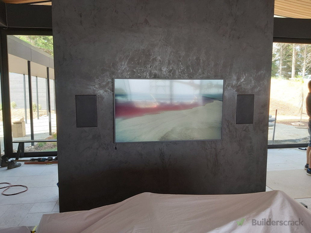 Flush TV installation with in-wall speakers for a clean, modern entertainment setup