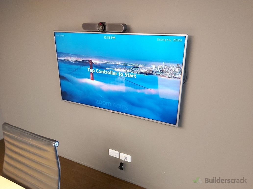 Conference room display installation with video conferencing camera for professional meeting setups