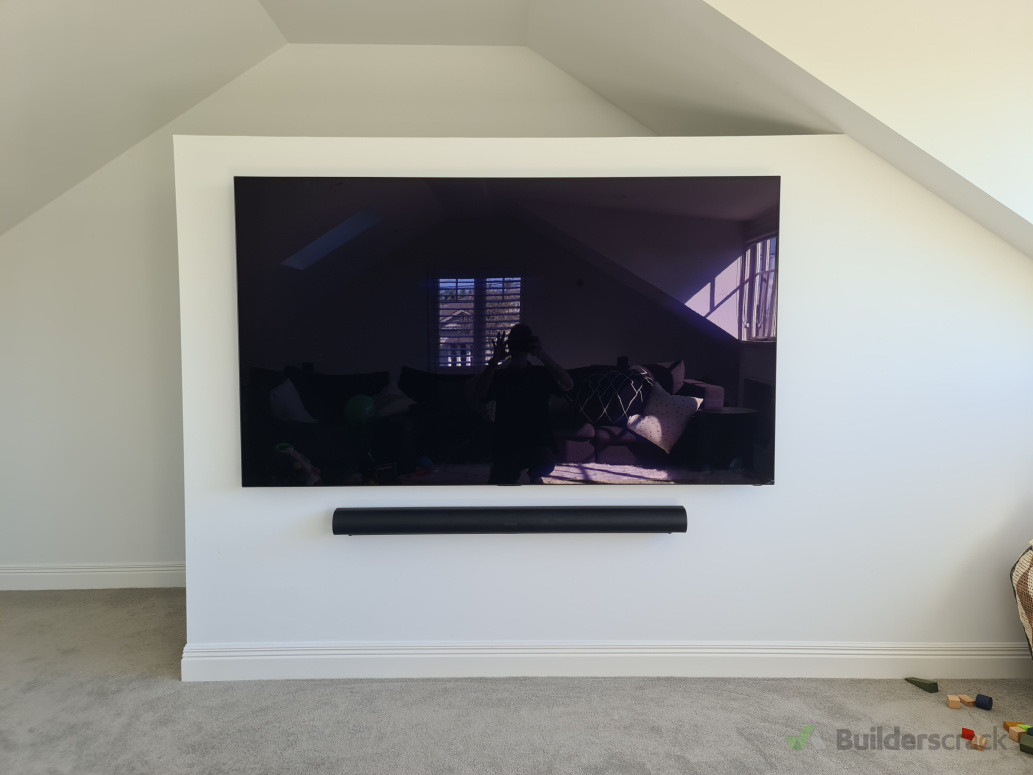 Built-in TV and soundbar installation providing a clean, modern home entertainment solution