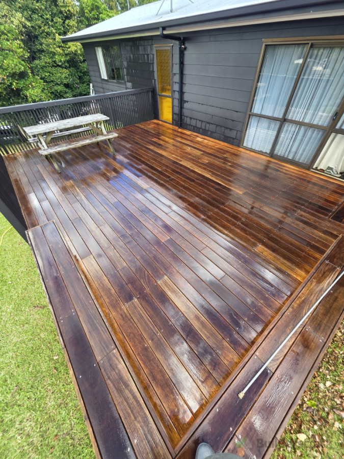 We apply a chemical then brush the deck clean and rinse with low pressure