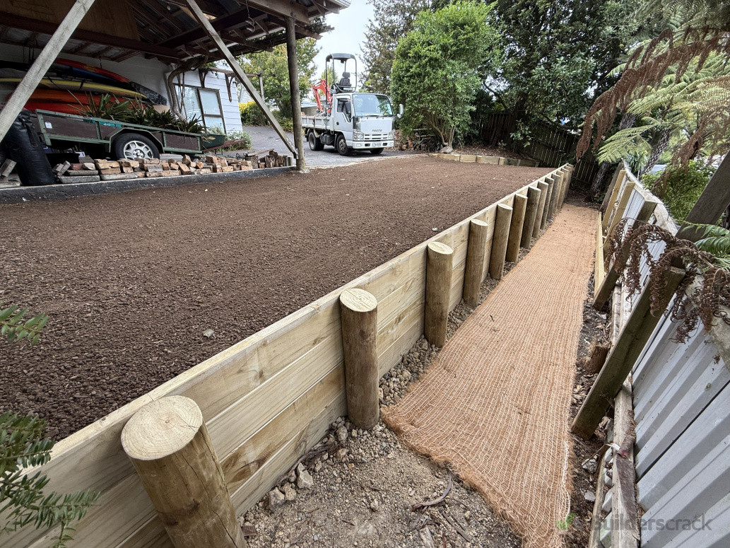 New retaining wall and site levelling. All prepped for new grass