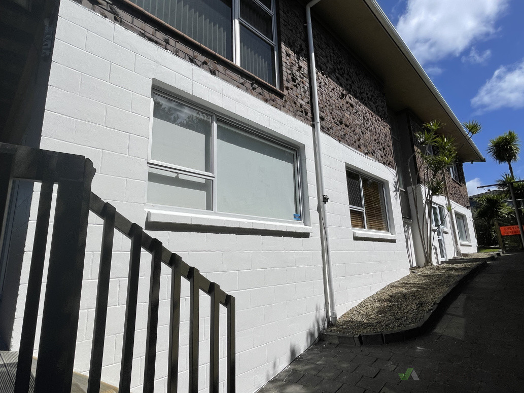 Freshly painted exterior block wall-North cote