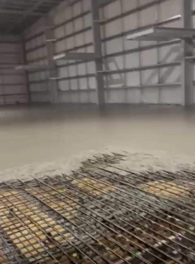 On-going pour of concrete slab.