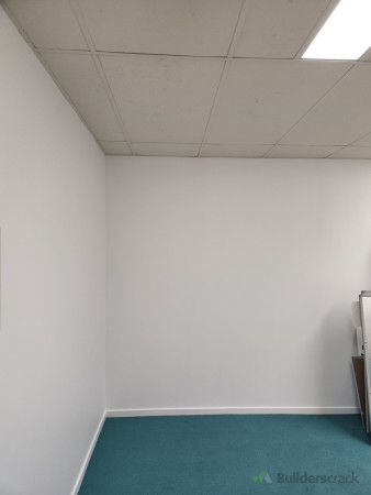 After - Main office - Red feature wall replaced with white