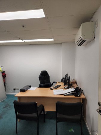 After - Main office - Purple feature wall replaced with white