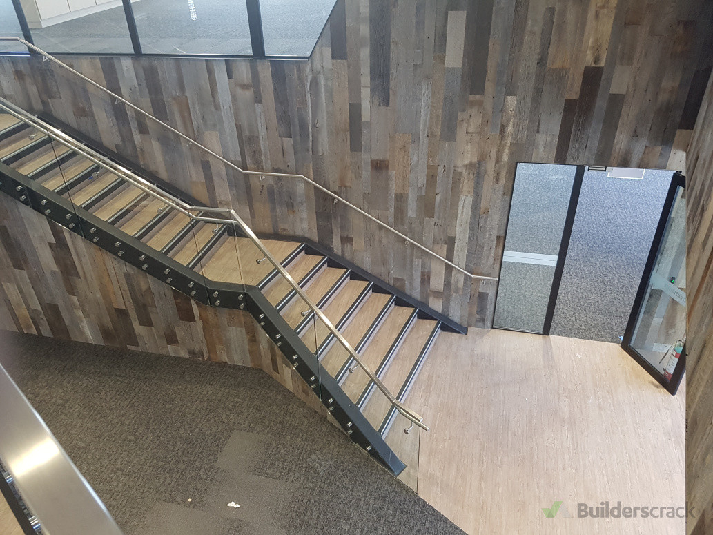 Commercial installation of LVT and nosings to stair well.