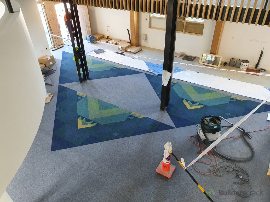 Hand cut carpet tiles installed to an architects design.