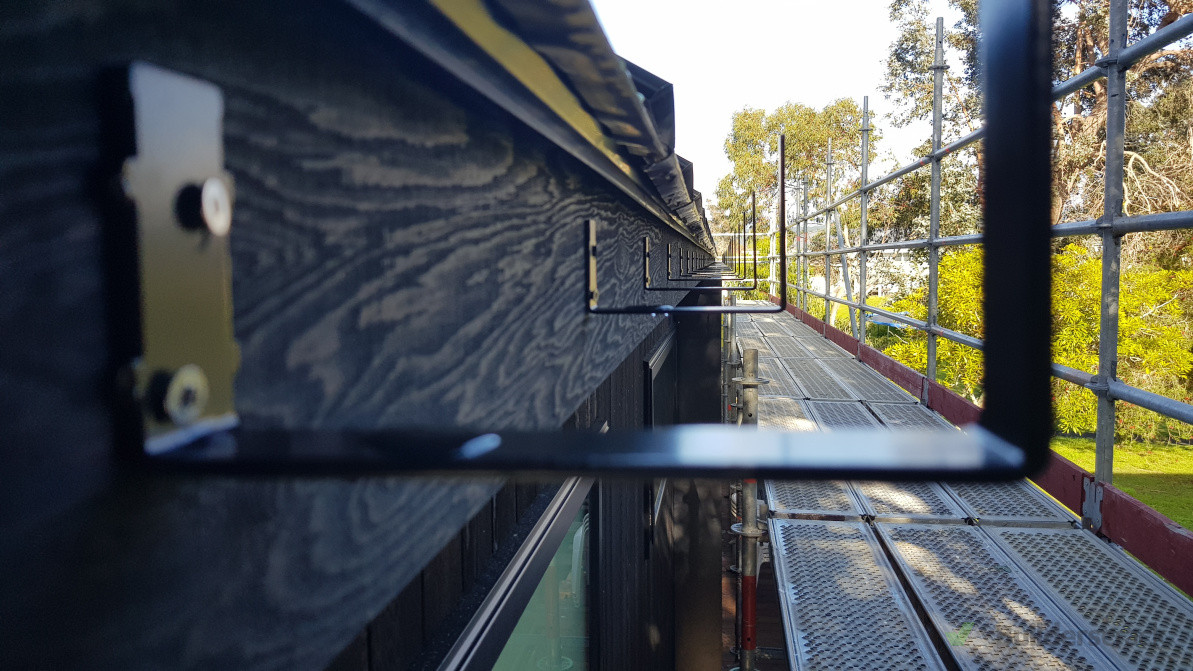 Precision gutter installation aligned for a clean, consistent finish that complements the overall structure.