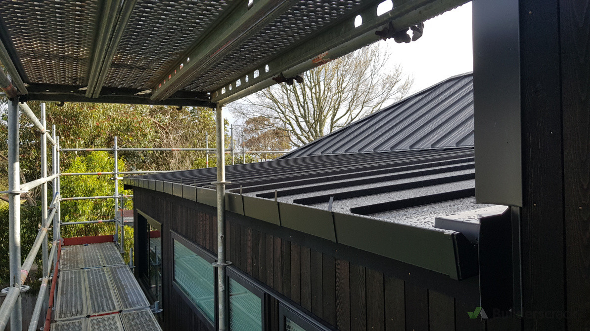 Gutter system precisely integrated with the roofline, delivering a clean, consistent, and architectural finish.