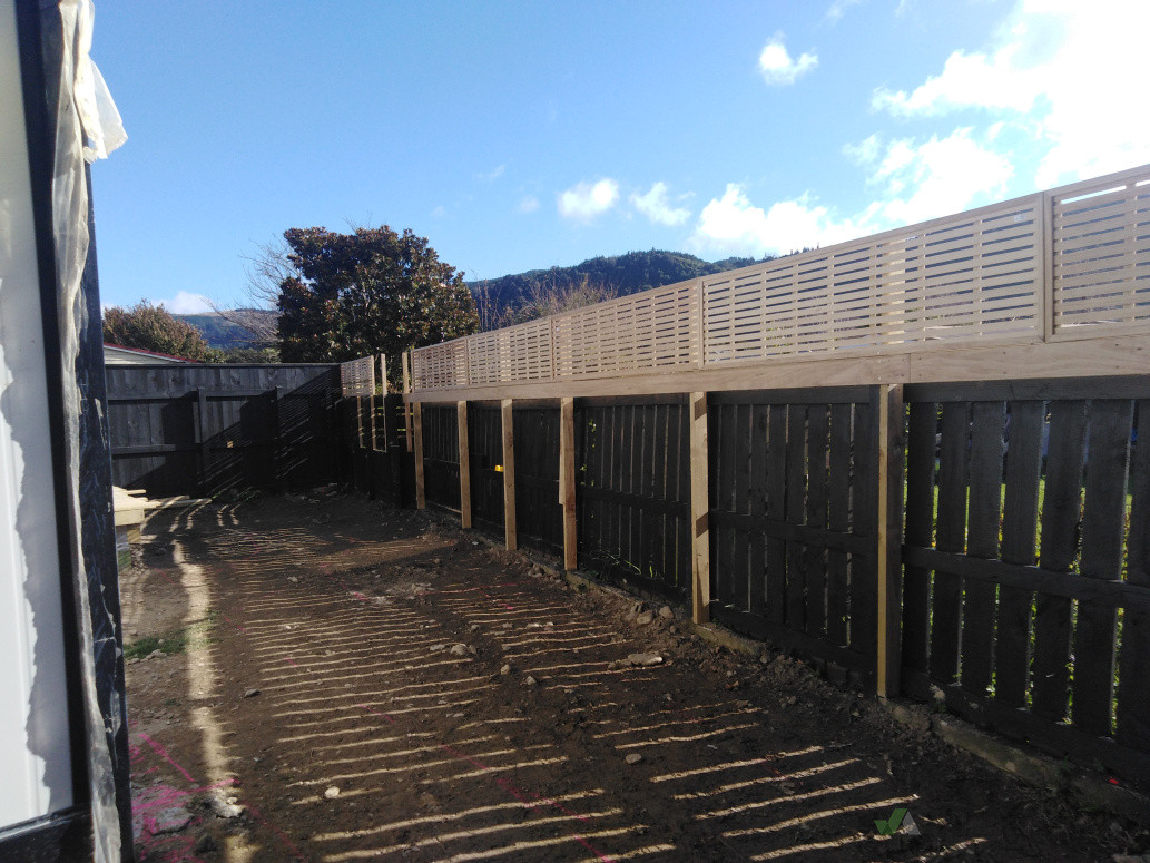 Fencing topper that was added for extra privacy not to mention the upgraded appearance  of an old black fence that was still structurally sound