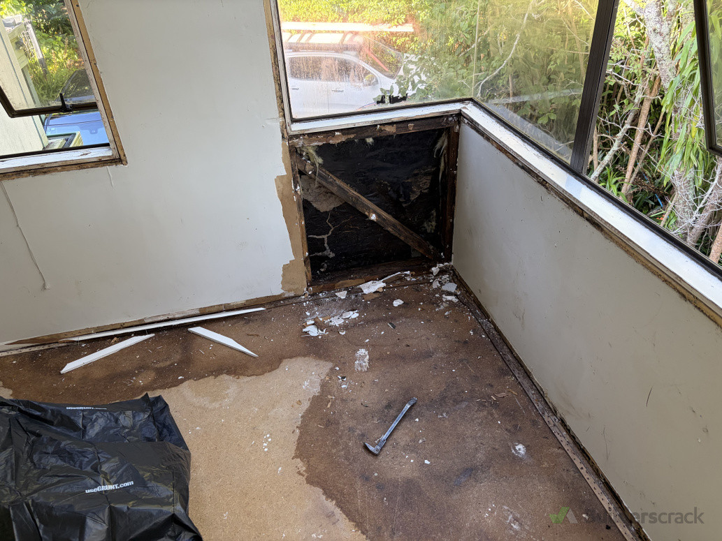 Water damage to wall and floor