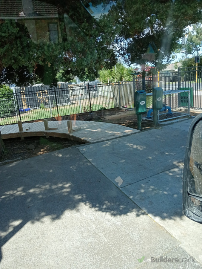 School concrete bad, decking walkway and garden.