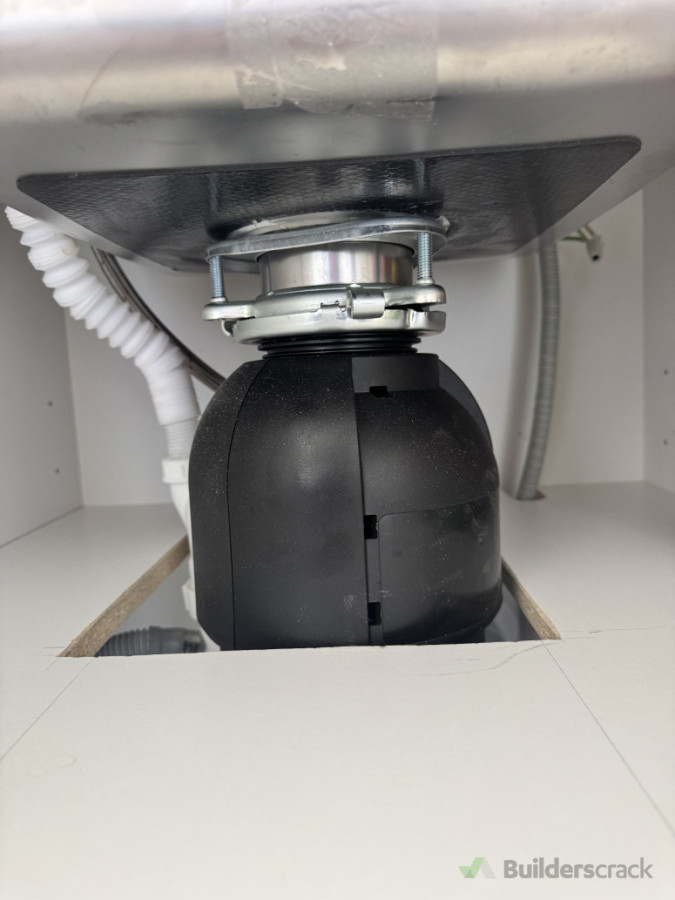 Plumbing modified and new waste disposal installed