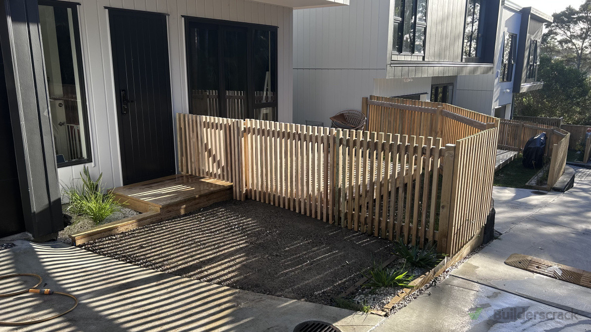 We cut back the deck to make an additional parking space and installed a fence around to keep her dog from getting out.