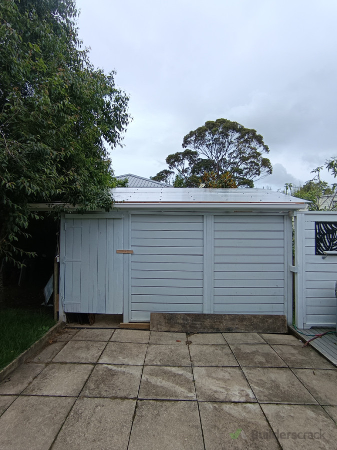 Side of the greenhouse was built to match the style of the existing fence