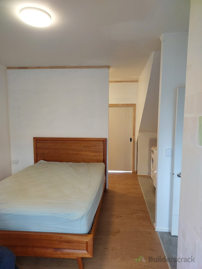 Plastered walls with flooring overlay installed