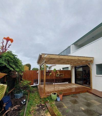 New pergola with tinted roof over existing deck
