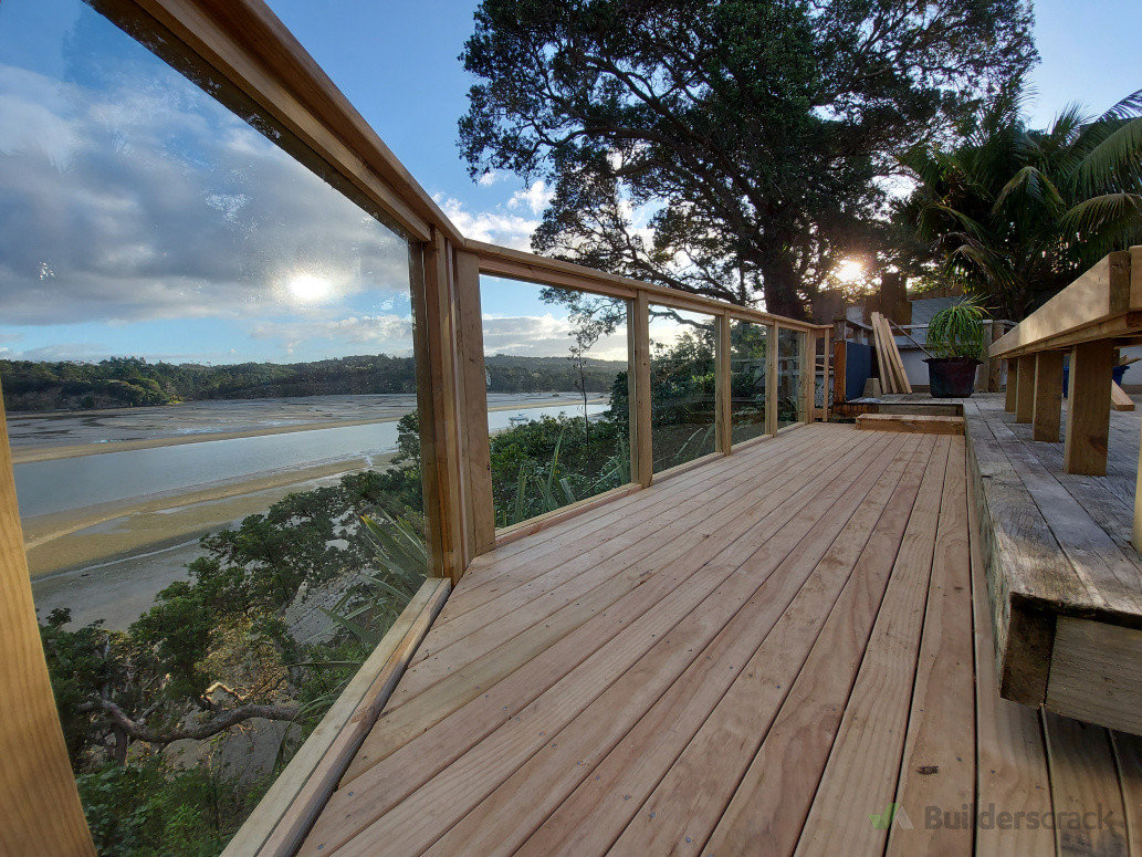 Safety glass panels installed between posts for un-interrupted viewing and a great wind block