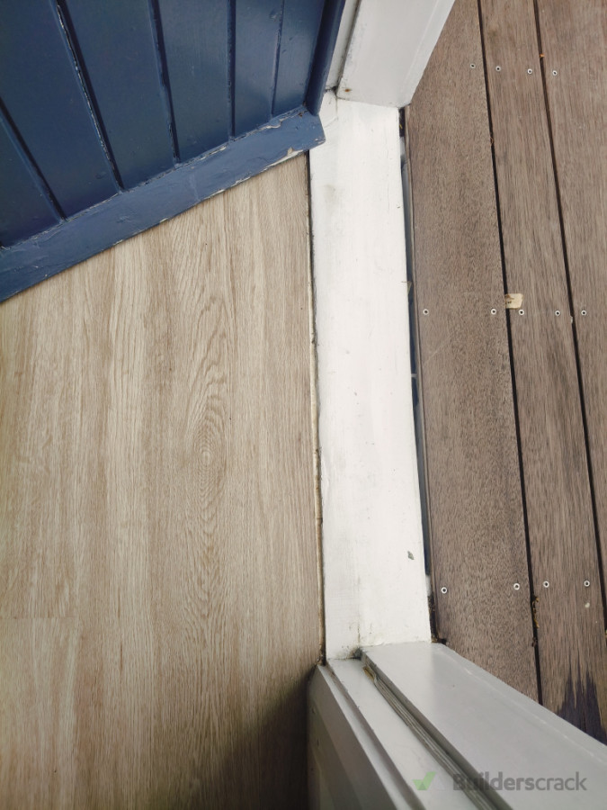 Door with no lip or mechanism to stop rain/air underneath door