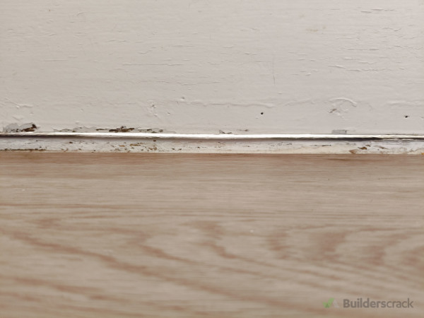 Visible gap at bottom of door where rain and cold air was coming in