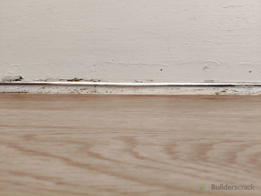 Visible gap at bottom of door where rain and cold air was coming in